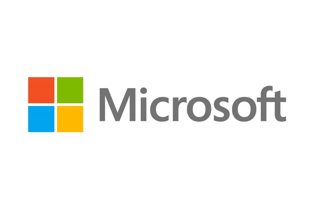 Microsoft logo with four primary ocloured squares and grey text on a white background